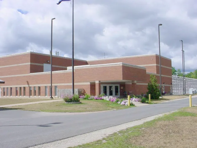 Former prison CO accused of role in assault by inmate